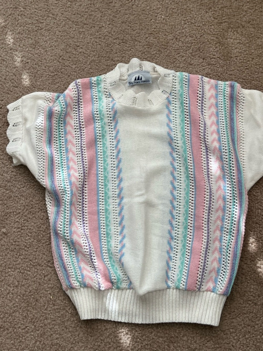 Vintage-Inspired White Knit Blouse with Pastel Stripes